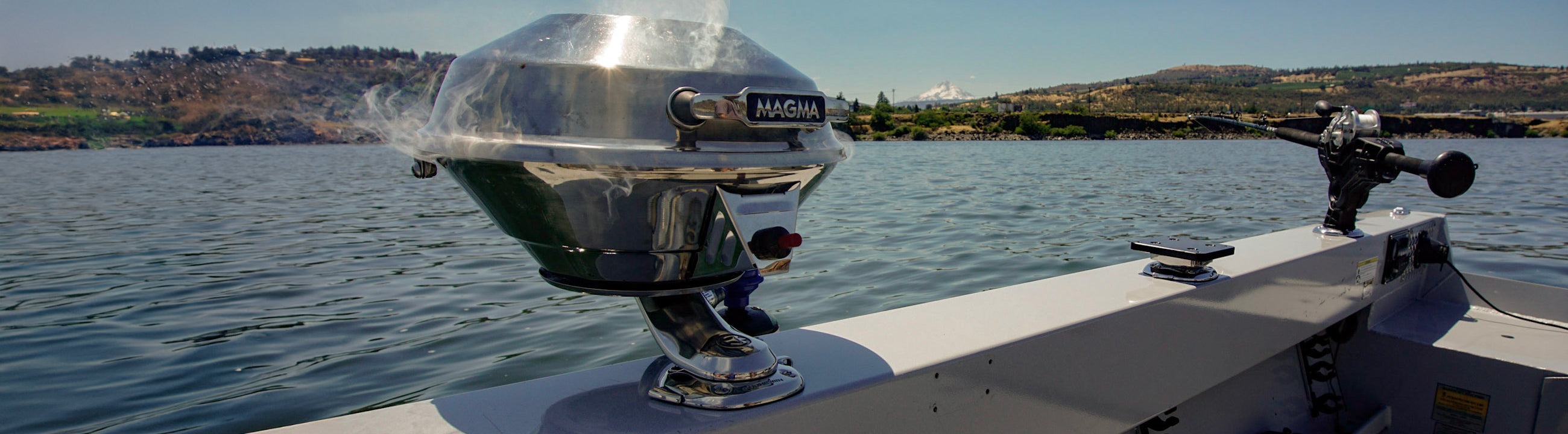 A fishing boat’s starboard quarter view of a gunwale mounted with variety of Burnewiin Bases and Adapters as seen from the perspective of a person in the boat.