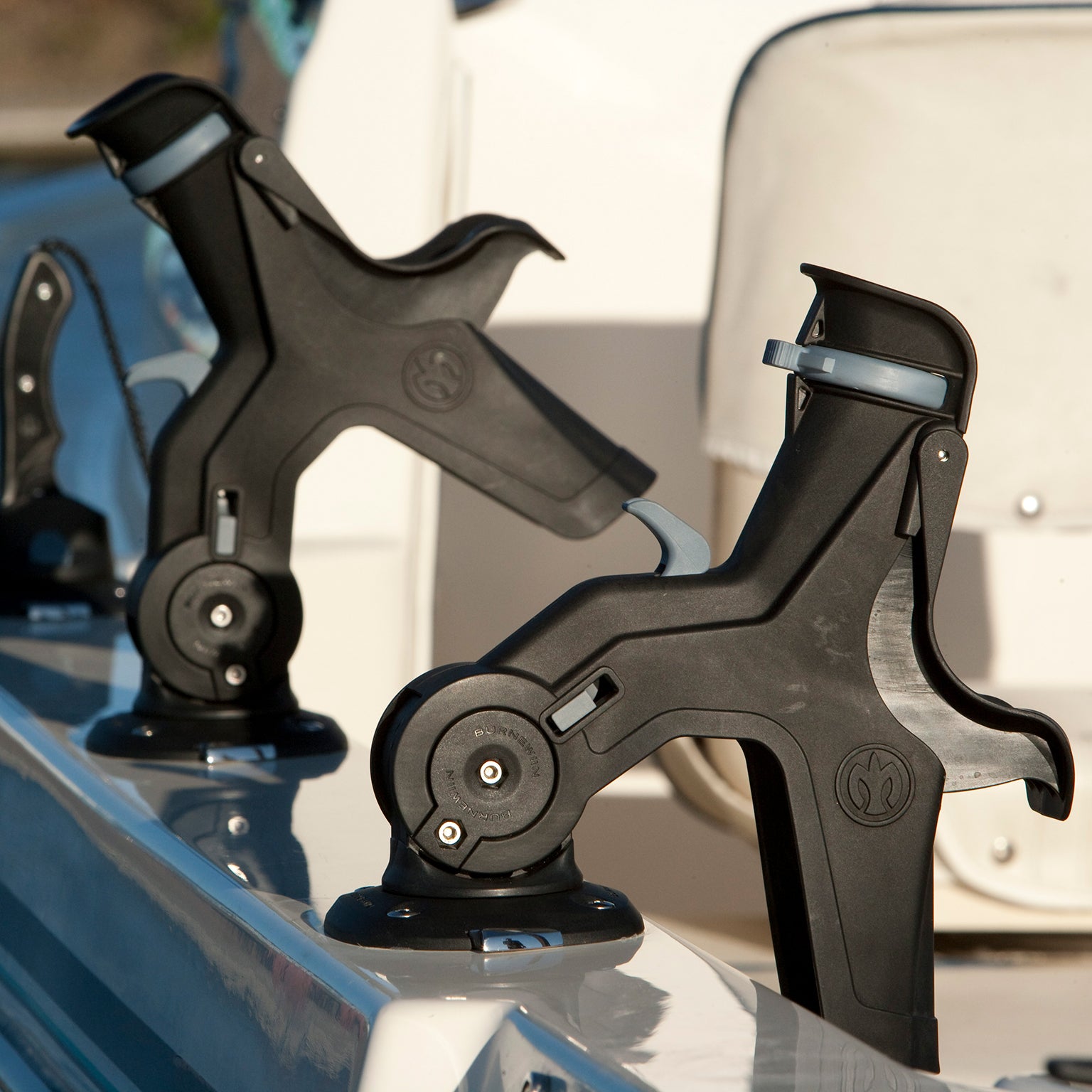 Looking down the gunwale of a fishing boat, a fishing boat outfitted with Burnewiin products including the Burnewiin RH5710 Rod Holder.