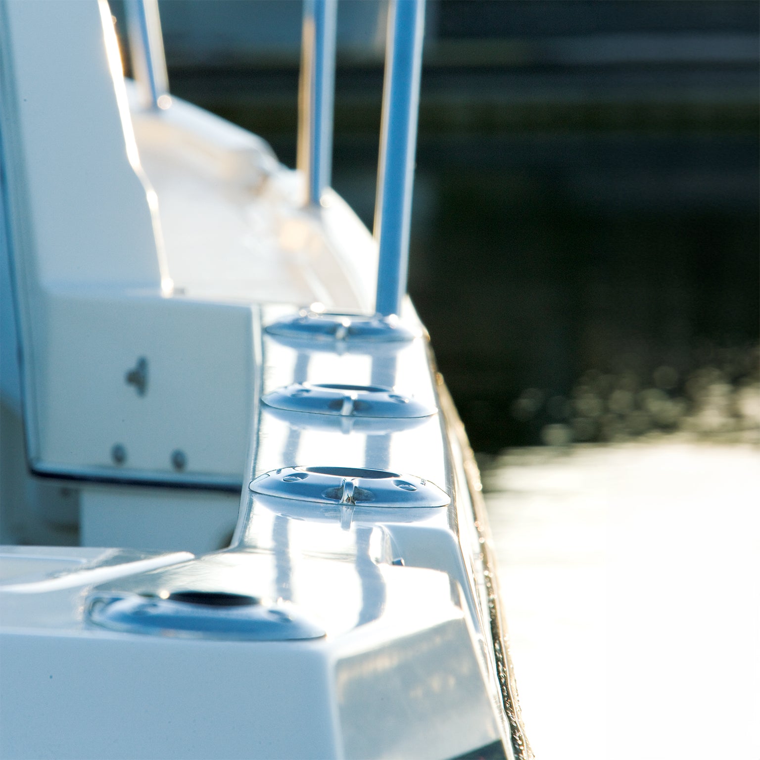A closeup view from behind a fishing boat fully installed with Burnewiin GM650 Mounts along the starboard gunwale.
