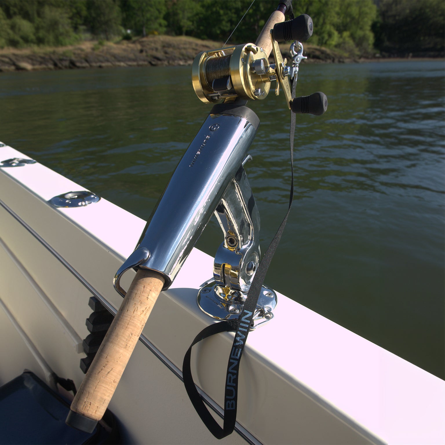 A close-up view of the Burnewiin RL5353 Rod Leash attached to a GM650 Mount and a fishing rod cradled in a RH8420 Rod Holder.