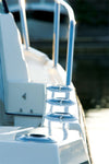 A closeup view from behind a fishing boat fully installed with Burnewiin GM650 Mounts along the starboard gunwale.
