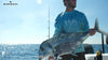 Rich Tudor from Saltwater experience holding a large fish in bow of boat outfitted with Burnewiin flush mount rod holders.