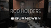 Burnewiin owner Tom Anderson standing in a display booth providing an overview of the Burnewiin composite rod holders.
